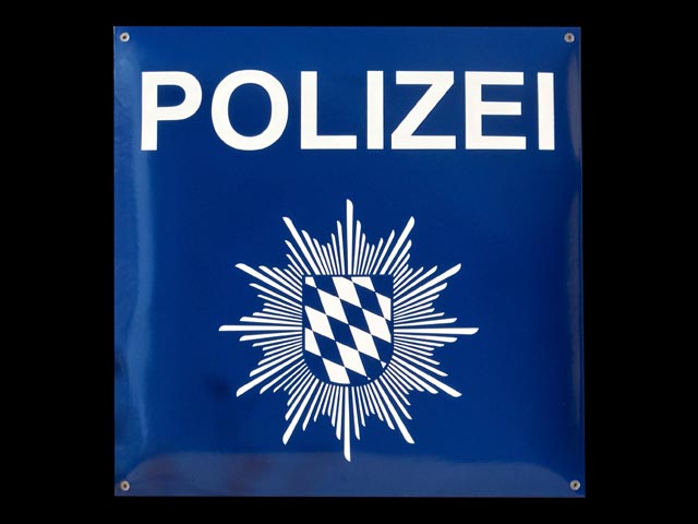 Firmenschild-Polizei